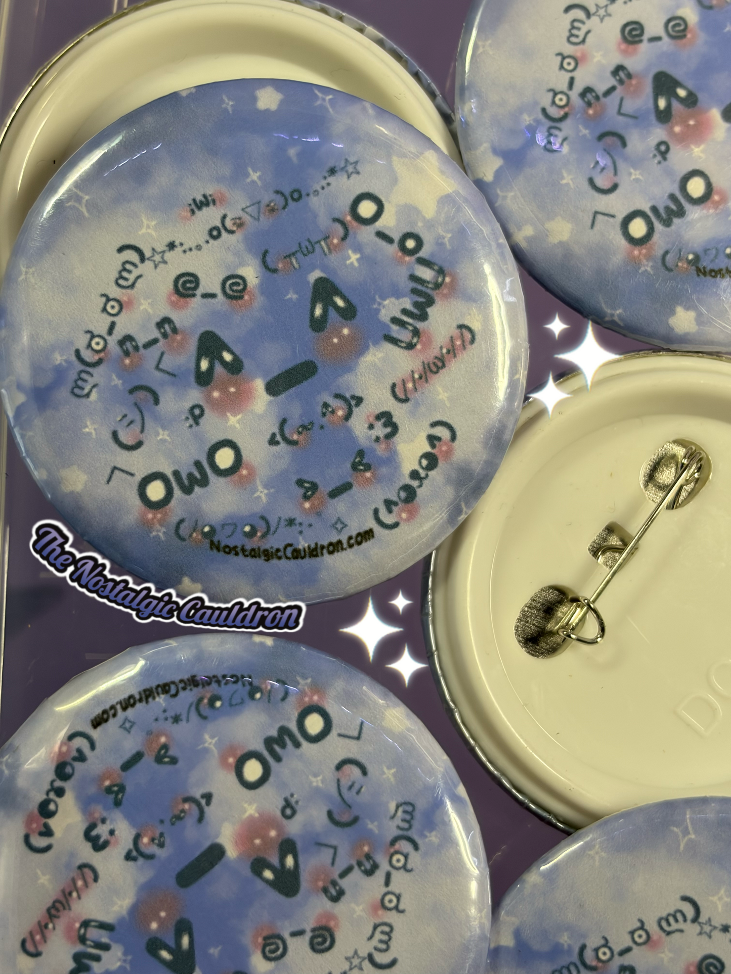 Set of decorative buttons with text and designs on a purple background