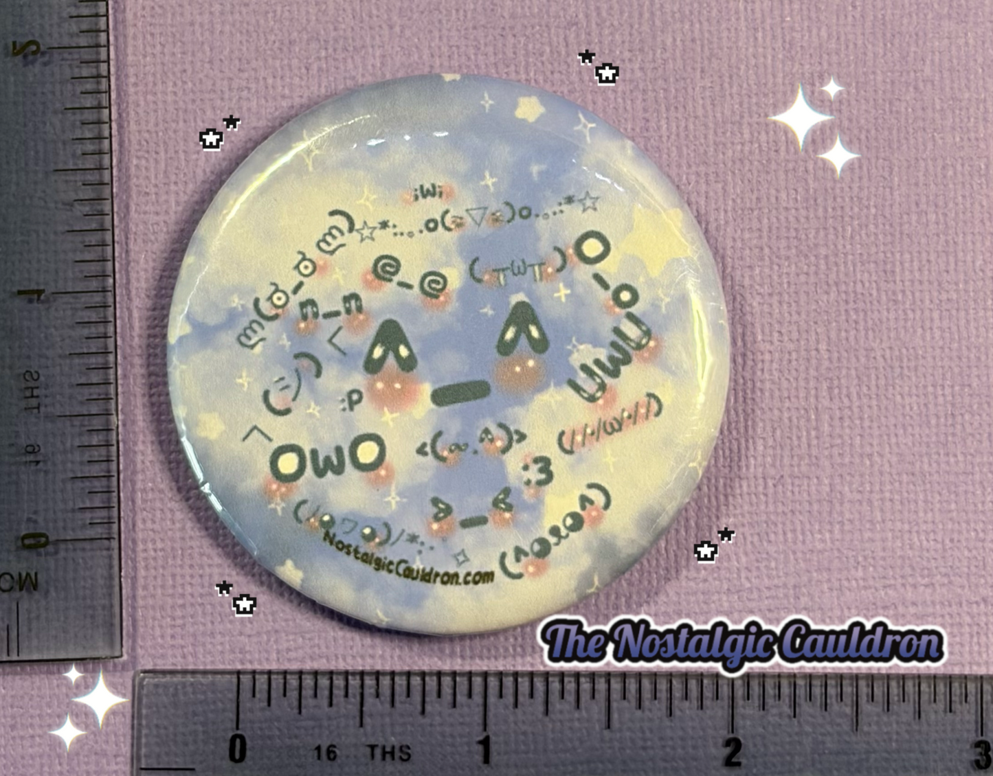 Round button badge with text and graphics on a purple background, next to a ruler.