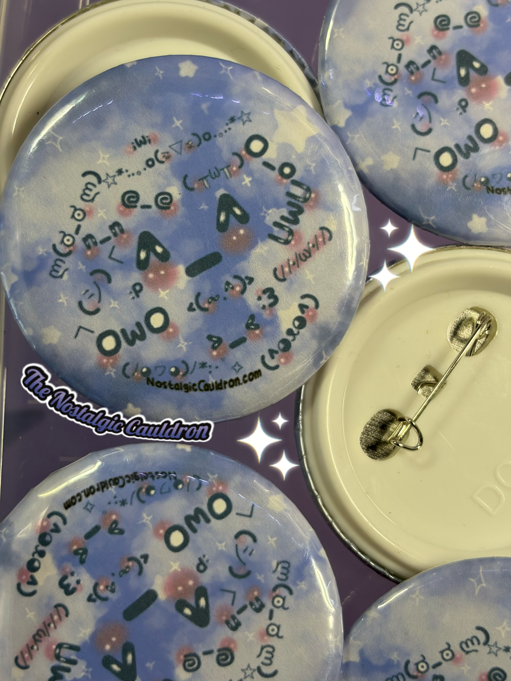 Set of decorative buttons with text and designs on a purple background